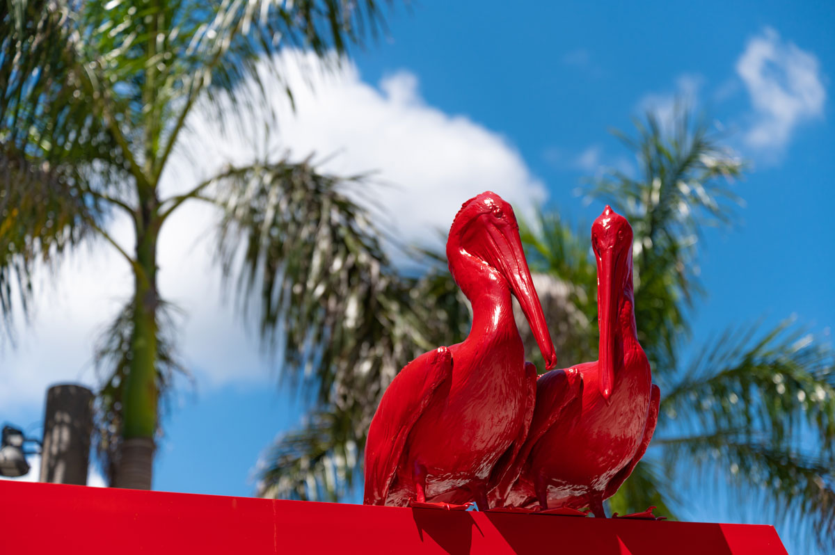 sculpture of two red pelicans