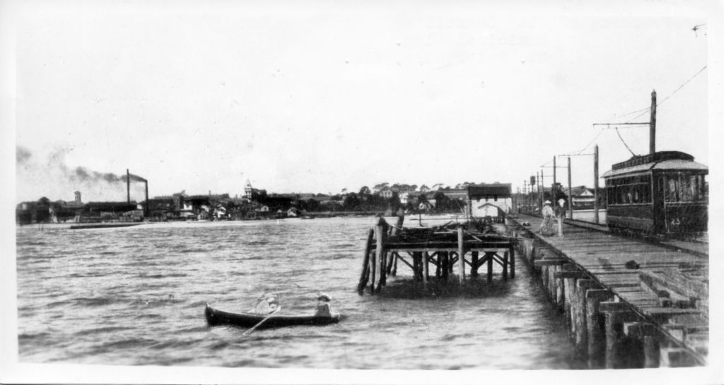 people docking at old electric pier