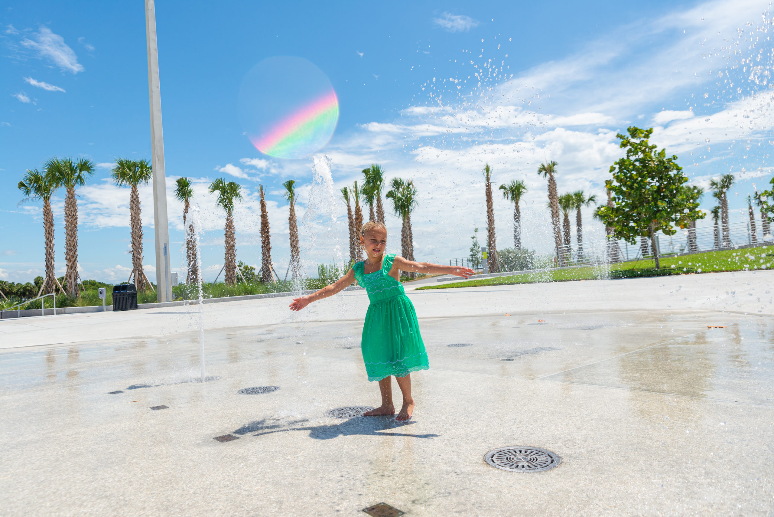 child playing in splash pad